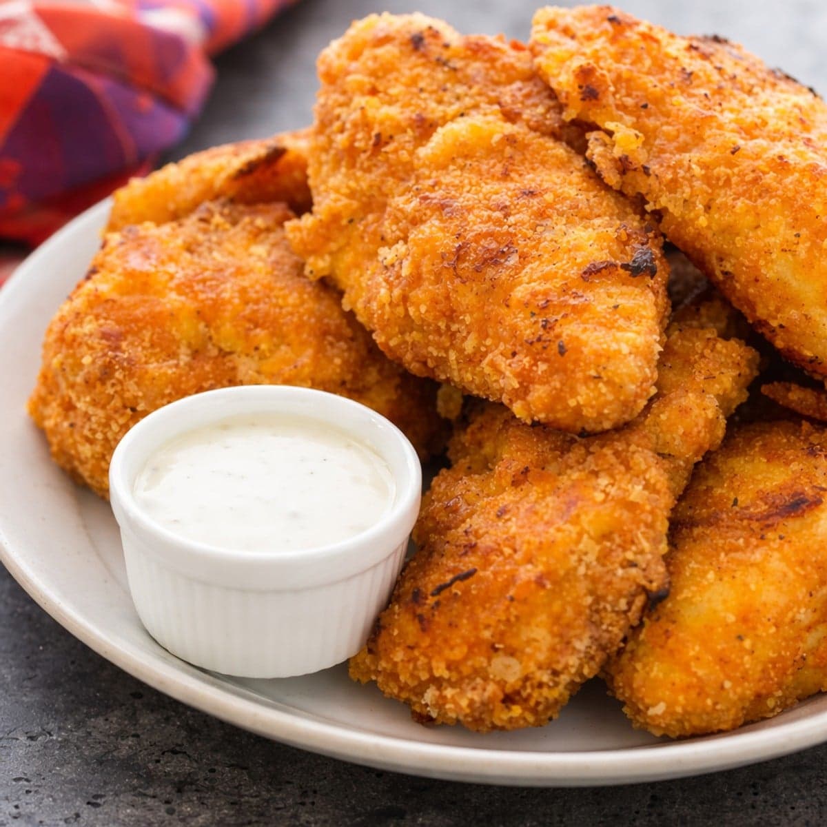 Cuisses et ailes de poulet panées