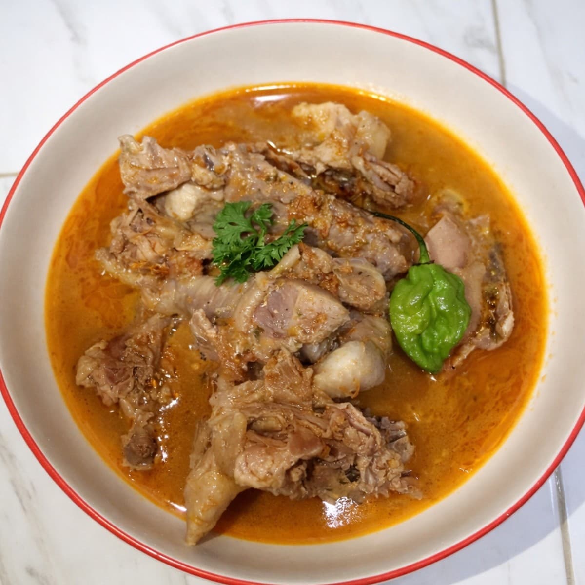 Soupe de poulet à l’akpi